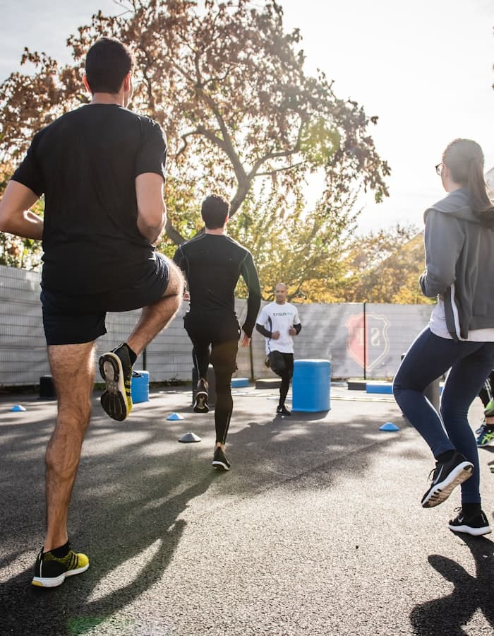 Group circuit training session outdoors
